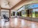 Spacious sunroom with tile floors and plenty of natural light at 8019 Arcadian Ct, Mount Dora, FL 32757