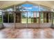 Sunroom with large windows overlooking a golf course at 8019 Arcadian Ct, Mount Dora, FL 32757