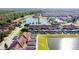 Aerial view of townhome community near lake at 8915 Candy Palm Rd, Kissimmee, FL 34747