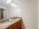 Bathroom with double vanity and granite countertop at 8915 Candy Palm Rd, Kissimmee, FL 34747