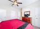 Bedroom with a queen bed and ceiling fan at 8915 Candy Palm Rd, Kissimmee, FL 34747