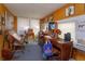 Home office with built-in shelving and large windows at 133 Agnes St, Winter Garden, FL 34787