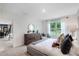 Main bedroom with a king-size bed and view into the dining room at 1429 Swift Ct, Kissimmee, FL 34759