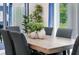 Modern dining room with wood table and six chairs at 1429 Swift Ct, Kissimmee, FL 34759