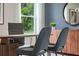 Home office with desk, two chairs, and large window at 1429 Swift Ct, Kissimmee, FL 34759