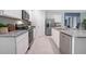 Modern kitchen with an island, granite countertops, and stainless steel appliances at 1429 Swift Ct, Kissimmee, FL 34759