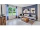 Living room with a sectional sofa and large window at 1429 Swift Ct, Kissimmee, FL 34759
