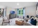 Living room with a sectional sofa and large window at 1429 Swift Ct, Kissimmee, FL 34759