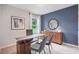 Modern home office with wood desk and accent wall at 1429 Swift Ct, Kissimmee, FL 34759
