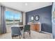 Home office with a desk, chairs, and large window at 1429 Swift Ct, Kissimmee, FL 34759