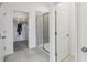 Clean bathroom with shower, closet, and tiled floor at 1708 Columbus Path, St Cloud, FL 34771