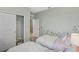 Cozy bedroom with twin beds, floral wall art, and closet at 1708 Columbus Path, St Cloud, FL 34771