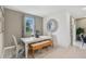 Bright dining room features a white table, bench, and four chairs at 1708 Columbus Path, St Cloud, FL 34771