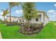 One-story home with gray siding, stone accents, and landscaped yard at 1708 Columbus Path, St Cloud, FL 34771