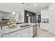 Kitchen island with granite countertops and stainless steel appliances at 1708 Columbus Path, Saint Cloud, FL 34771