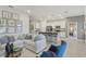Open living room with sectional sofa and island kitchen view at 1708 Columbus Path, St Cloud, FL 34771