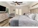 Spacious main bedroom with king bed and access to private balcony at 236 Wise Owl Way, Winter Springs, FL 32708