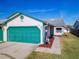 View of a house's exterior, highlighting the garage and walkway at 2435 Turpin Dr, Orlando, FL 32837