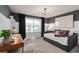 Bedroom with dark gray accent wall, built-in desk, and daybed at 2555 Winsome Way, Davenport, FL 33896