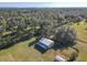 Aerial view of home, outbuildings, and vast property overlooking water at 2607 Osceola Bluff Ln, Geneva, FL 32732