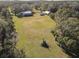 Aerial view of property with home, outbuildings, and large lot at 2607 Osceola Bluff Ln, Geneva, FL 32732