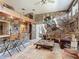 Rustic-style game room with a wet bar and leather furniture at 2607 Osceola Bluff Ln, Geneva, FL 32732