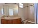 Updated bathroom with a shower, toilet, and vanity with wood cabinets at 3660 Wilshire Way Rd # 260, Orlando, FL 32829