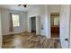 Large bedroom with wood-look flooring, a walk-in closet, and an ensuite bathroom at 3660 Wilshire Way Rd # 260, Orlando, FL 32829