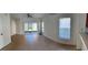 Bright living room featuring tile floors, sliding glass doors, and a ceiling fan at 3660 Wilshire Way Rd # 260, Orlando, FL 32829