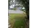 Large grassy backyard with a white fence at 378 Southern Charm Dr, Orlando, FL 32807
