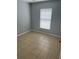 Bright bedroom with tile flooring and a window with blinds at 378 Southern Charm Dr, Orlando, FL 32807