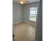 Spacious bedroom with tile flooring and a window with blinds at 378 Southern Charm Dr, Orlando, FL 32807