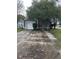 Gray house with a white garage door and landscaping at 378 Southern Charm Dr, Orlando, FL 32807