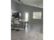 Modern kitchen with island, stainless steel appliances, and breakfast bar at 378 Southern Charm Dr, Orlando, FL 32807