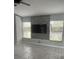 Living room featuring a contemporary fireplace and large windows at 378 Southern Charm Dr, Orlando, FL 32807