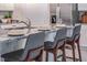 Granite kitchen island with seating for three at 418 St Johns Ln, Kissimmee, FL 34759