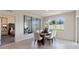 Dining area with glass-top table and chairs, view into bedroom at 431 Taylor Groves Dr, Lake Wales, FL 33898