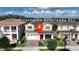 Two story house with a three car garage and landscaped yard at 9859 Winnington St, Orlando, FL 32832