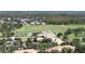 Community overview featuring houses, golf course, and landscape at 9859 Winnington St, Orlando, FL 32832