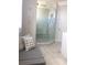 Spa-like bathroom with a large walk-in shower and bench at 9859 Winnington St, Orlando, FL 32832