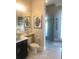 Bathroom with walk-in shower, toilet and vanity at 9859 Winnington St, Orlando, FL 32832