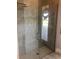Spa-like bathroom with a large walk-in shower, gray tile, and a modern design at 9859 Winnington St, Orlando, FL 32832