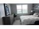 Spacious bedroom with dresser and a comfortable bed at 9859 Winnington St, Orlando, FL 32832