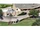 Golf clubhouse with stone exterior, parking, and golf carts at 9859 Winnington St, Orlando, FL 32832