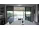 Dining area with glass doors leading to a relaxing balcony at 9859 Winnington St, Orlando, FL 32832