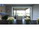 Open dining room with a view of the backyard patio and lake at 9859 Winnington St, Orlando, FL 32832