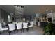 Elegant dining room with a large table, chandelier, and open floor plan at 9859 Winnington St, Orlando, FL 32832