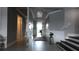 Elegant entryway with gray walls, tiled floor, and staircase at 9859 Winnington St, Orlando, FL 32832