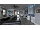 Spacious living room with sectional sofa, kitchen, and entryway visible at 9859 Winnington St, Orlando, FL 32832