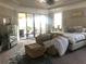 Grand main bedroom with sitting area and access to balcony at 9859 Winnington St, Orlando, FL 32832